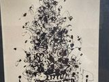a drawing of a christmas tree on display in a glass case