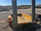 an image of a flatbed trailer parked in a lot