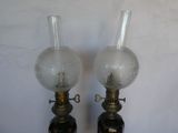 two lamps that are sitting next to each other on a table