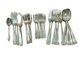 six forks and spoons sitting next to each other on a table