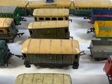 a lot of toy trains that are sitting on a table