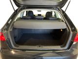 the back of a car with its trunk open and the back seats down