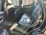 a black car with a black leather seat in the back of it