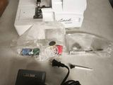 an image of a sewing machine and other items on a table
