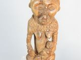 a small statue of a man with a hat on top of a table