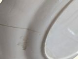 a close up of a toilet seat with the lid up