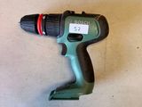 a cordless drill that is sitting on a table