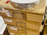 a stack of boxes with a white plate on top of it