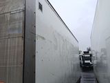 two trucks that are parked next to each other