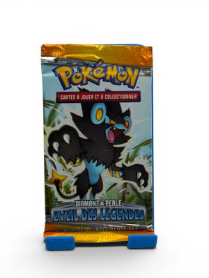 a close up of a box of pokemon cards on a white surface