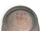 a close up of a metal container with writing on it