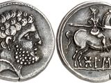 a close up of a silver coin with a horse and rider on it