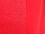 a close up of a red shirt with a white collar