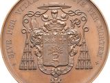 an image of a bronze medal with a coat of arms on it