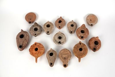several pieces of pottery are arranged in a circle on a white surface