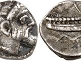une pièce d'argent portant l'image d'un homme