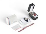 a close up of a box with a watch inside of it