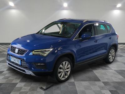 a blue suv parked in a garage with a checkered floor