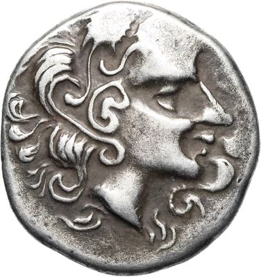 Gros plan sur une pièce de monnaie portant le visage d'un homme