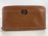 the brown leather wallet has a metal buckle on the front