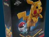 a box with a lego pikachu and pikachu figure in it