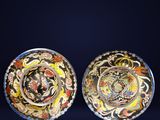 pair of chinese cloise plates decorated with birds and flowers