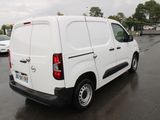 a white van that is parked in a parking lot