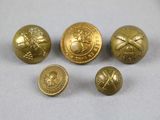 four brass buttons with a picture of a man and a woman on them