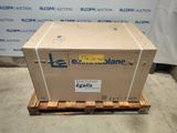 an empty box sitting on a pallet in front of a blue and white sign