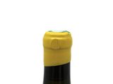 a bottle of wine that is sitting on a table