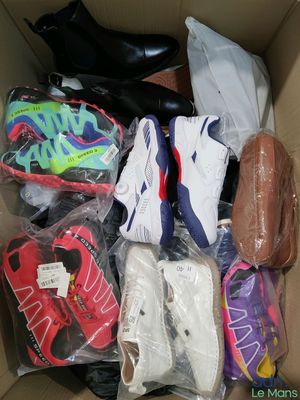 many pairs of shoes in a box on the floor