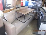 an image of a couch and a table in a garage