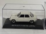 a small white car in a clear case on a table