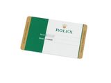 a close up of a green and white business card on a white background