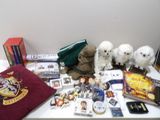a lot of harry potter items on the table
