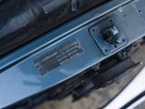 a close up of a car ' s engine and its cover
