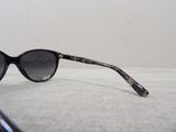 a pair of sunglasses sitting on a white surface