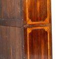 a tall wooden cabinet with a clock on top of it