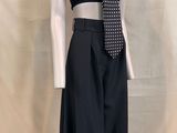 a mannequin wearing a black top and black pants