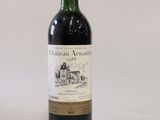 a bottle of wine that is sitting on a table