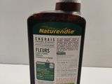 a bottle of liquid that is sitting on a table