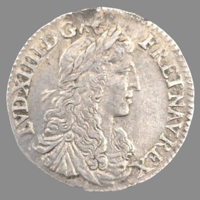 une pièce d'argent à l'effigie d'une femme coiffée d'une couronne