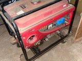 a small generator that is sitting in the garage