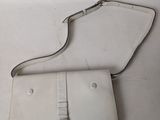 an image of a white purse sitting on top of a white table