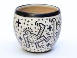 a black and white bowl with a design on it