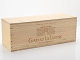 the wooden box is holding a bottle of wine on a white surface