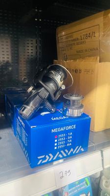 a blue box with a camera on top of it on a shelf