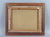an old picture frame with a piece of wood in it