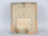 an old picture frame with a piece of paper and a piece of paper on it