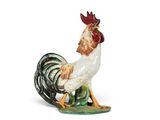 une figurine représentant un coq sur fond blanc